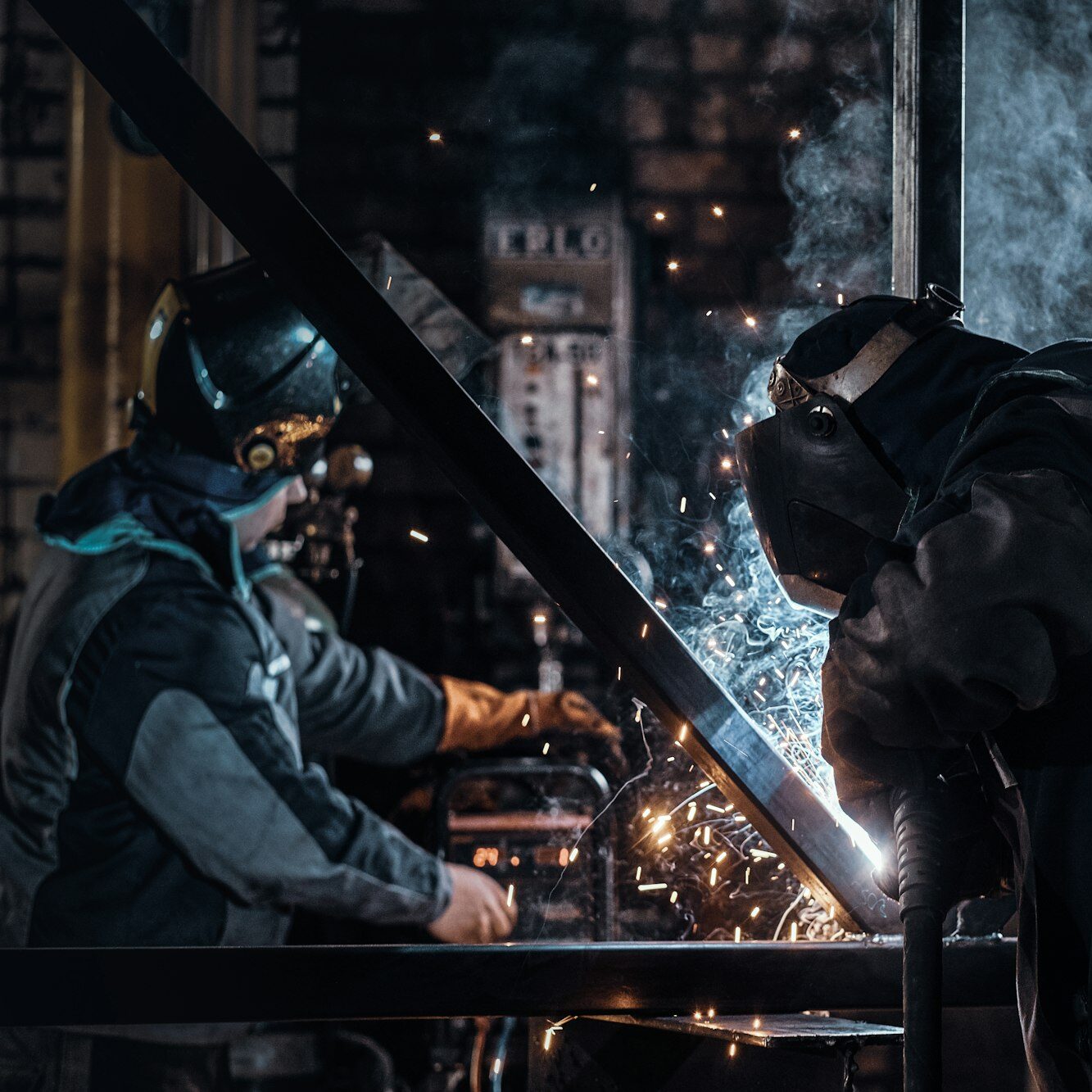 Man is working at the busy metal factory